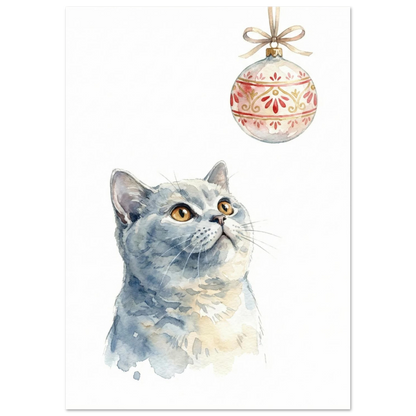 Kattposter med julkula i guld och rött mot vit bakgrund